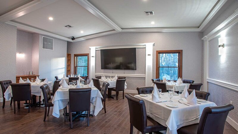 Side dining room with multiple set tables